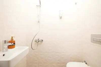 a bathroom with a shower and a toilet and a sink at Charming 3BR 2Bath AC in Center - Santur D2 in Istanbul