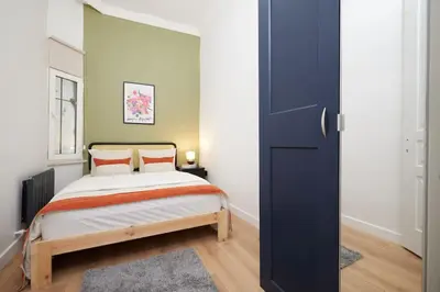 a bedroom with a bed and a blue door at Charming 3BR 2Bath AC in Center - Santur D2 in Istanbul