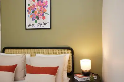 a bedroom with a bed and a picture on the wall at Charming 3BR 2Bath AC in Center - Santur D2 in Istanbul