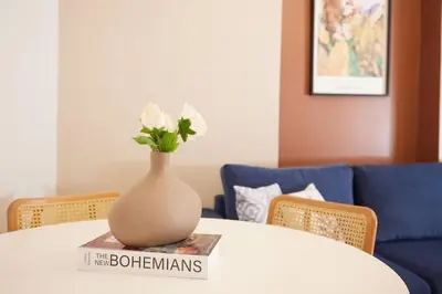 a vase with flowers sitting on top of a book at Charming 3BR 2Bath AC in Center - Santur D2 in Istanbul