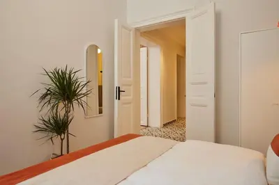 a bedroom with a bed and a mirror and a plant at Stunning 3BR 2Bath AC in Center - Santur D3 in Istanbul