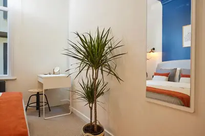 a room with a bedroom with a bed and a plant at Stunning 3BR 2Bath AC in Center - Santur D3 in Istanbul