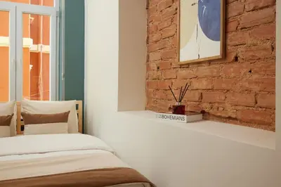 a bedroom with a brick wall and a bed at Stunning 3BR 2Bath AC in Center - Santur D3 in Istanbul