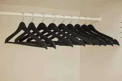a bunch of black hangers in a closet at Stunning 3BR 2Bath AC in Center - SanturD4 in Istanbul