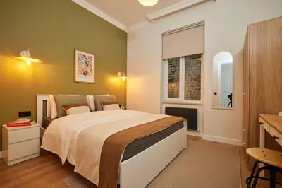 a bedroom with a large bed and a window at Spacious 6BR 3Bath AC in Center - Santur D5-6 in Istanbul