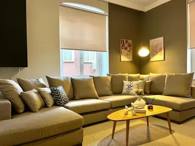 a living room with a couch and a table at Spacious 6BR 3Bath AC in Center - Santur D5-6 in Istanbul