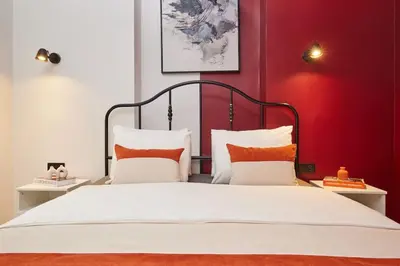 a bedroom with a large bed with red walls at Spacious 6BR 3Bath AC in Center - Santur D5-6 in Istanbul