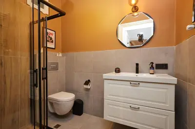 a bathroom with a toilet and a sink and a mirror at Charming 3BR 2Bath AC in Center - Santur D7 in Istanbul