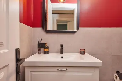 a bathroom with a white sink and a mirror at Charming 3BR 2Bath AC in Center - Santur D8 in Istanbul