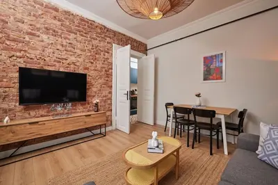 a living room with a brick wall at Charming 3BR 2Bath AC in Center - Santur D8 in Istanbul