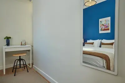 a bedroom with a bed and a mirror at Spacious 3BR 2Bath AC in Center - Santur D9 in Istanbul