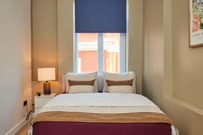 a bedroom with a large bed with a window at Spacious 3BR 2Bath AC in Center - Santur D9 in Istanbul