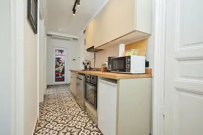 a small kitchen with a counter and a microwave at Spacious 3BR 2Bath AC in Center - Santur D9 in Istanbul