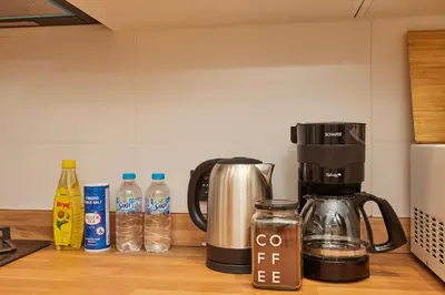 a coffeemaker and a coffee maker on a kitchen counter at Spacious 3BR 2Bath AC in Center - Santur D9 in Istanbul