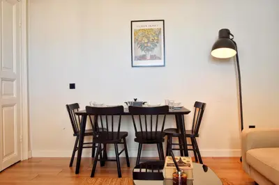 a dining room table with chairs and a lamp at Cozy Renovated 3BR near Taksim- Santur D10 in Istanbul