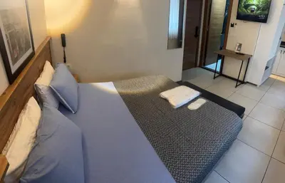 a blue bed in a room with at The balo pera hotel in Istanbul