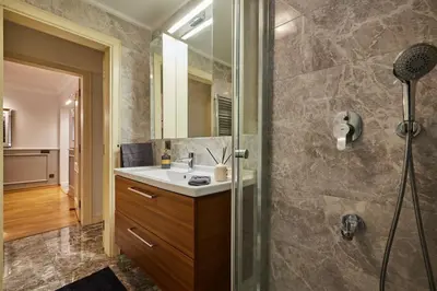a bathroom with a sink and a shower with a mirror at Stunning Apartment in Bebek - Manolya8 in Istanbul