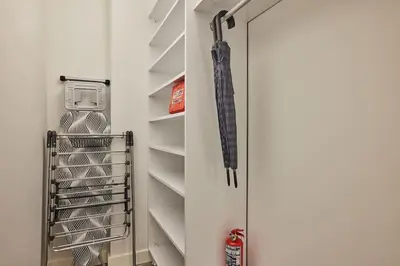 an umbrella is hanging in a walk in closet at Stunning Apartment in Bebek - Manolya8 in Istanbul