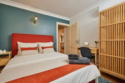 a bedroom with a large bed and a chair at Stunning Apartment in Bebek - Manolya8 in Istanbul