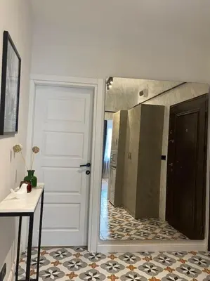 a bathroom with a shower with a mirror and a door at Stunning Apartment Near Metro - Değirmen 64 in Istanbul
