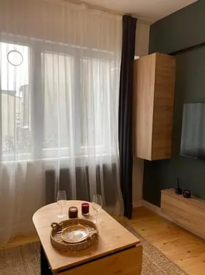 a room with a table with glasses and a bowl on it at Stunning Apartment Near Metro - Değirmen 64 in Istanbul