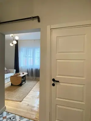 a door leading into a room with a living room at Stunning Apartment Near Metro - Değirmen 64 in Istanbul