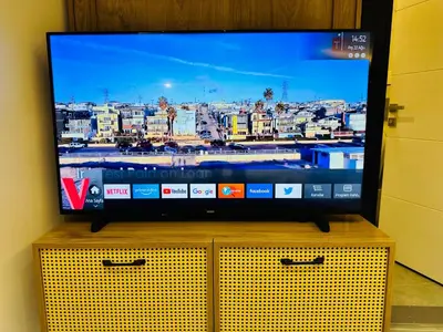 a flat screen tv sitting on top of a dresser at Rose Point Residence in Istanbul