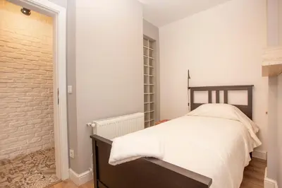a bedroom with a bed and a brick wall at Waterfront Apartments with a Stunning View in Istanbul