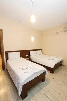a room with two beds in a room at Marmara Apartments in Istanbul