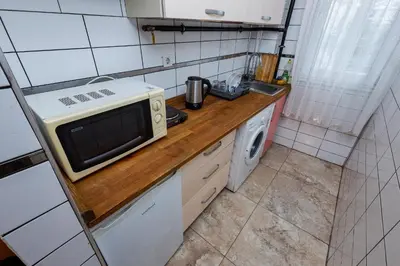 a small kitchen with a microwave on a counter at Marmara Apartments in Istanbul