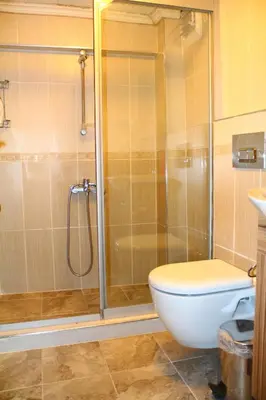 a bathroom with a shower and a toilet at Marmara Apartments in Istanbul