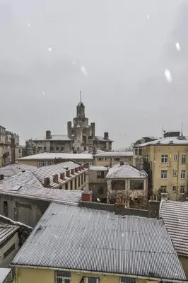 a view of a city with snow covered roofs at By Murat Royal Hotel Galata in Istanbul