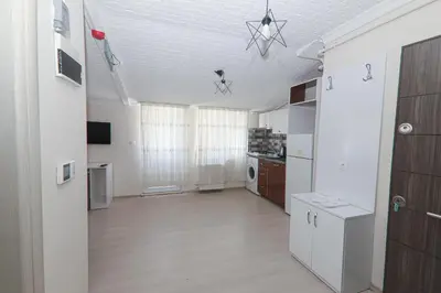 an empty room with a kitchen and a ceiling at PARADİSE pansiyon otel in Nilüfer