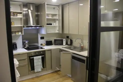 a small kitchen with a sink and a microwave at Lovely One Bedroom Appartment-530 in Istanbul