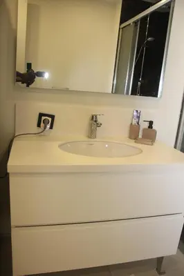 a white sink in a bathroom with a mirror at Lovely One Bedroom Appartment-530 in Istanbul
