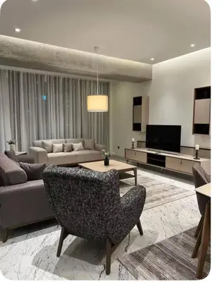 a living room with a couch and a television at Enjoy luxury family apt in Istanbul