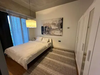 a bedroom with a white bed and a window at Cozy luxury apt in Sinpas queen in Istanbul