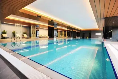 a large swimming pool in a hotel at Cozy luxury apt in Sinpas queen in Istanbul