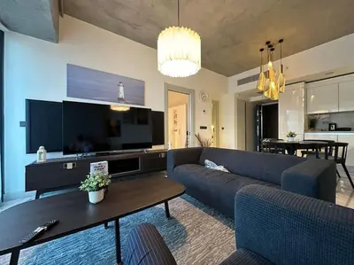 a living room with a couch and a table at Cozy luxury apt in Sinpas queen in Istanbul