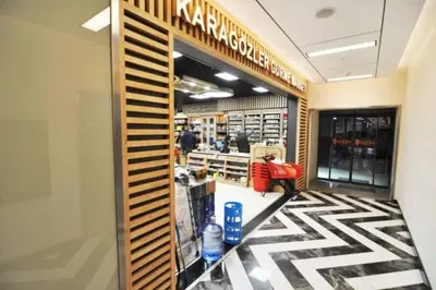 a woman sitting in the aisle of a pharmacy at Elegant 2 bedroom apt Sinpas queen gym pools in Istanbul