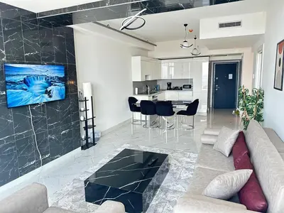 a living room with a couch and a table at Luxury apt in the 40 plus floor in Istanbul