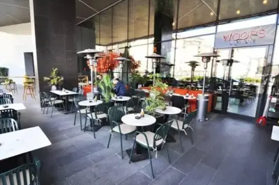 a dining room with tables and chairs in a restaurant at Luxury apt in the 40 plus floor in Istanbul