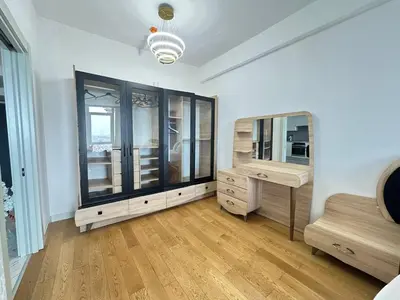 a room with a dresser and a mirror in it at Luxury apt in the 40 plus floor in Istanbul