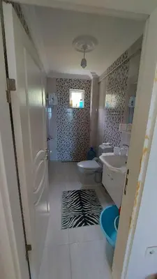 a bathroom with a sink and a toilet and a tub at Kadıoğlu Pansiyon in Ormanlı