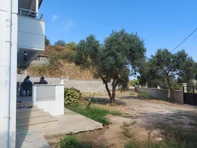 a view from the outside of a house with a tree at Kadıoğlu Pansiyon in Ormanlı