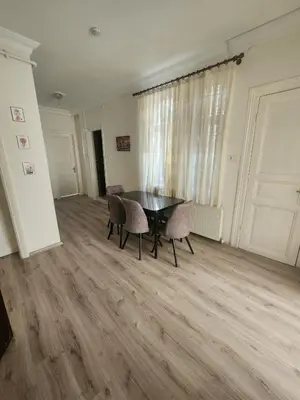 a dining room with a table and two chairs at Nostalgia Apartment in Istanbul