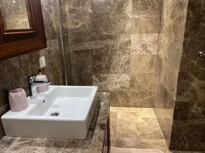 a bathroom with a sink and a shower at ultra lüxs in Istanbul