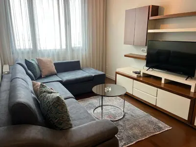 a living room with a couch and a television at ultra lüxs in Istanbul
