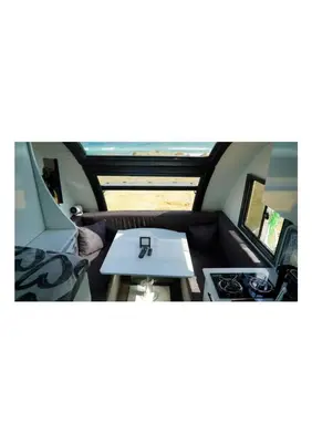 a small table in the back of a camper van at HUZURLU BİR TATİl - CARAVAN SERENITY in Domalı