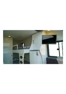 a kitchen with a refrigerator and a microwave at HUZURLU BİR TATİl - CARAVAN SERENITY in Domalı